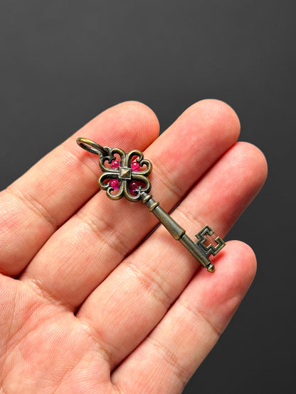 Rare Vintage Steel Flame Bronze Key Pendant with Ruby Inlay