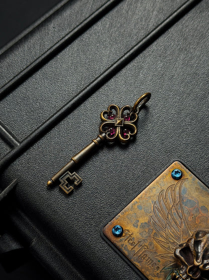 Rare Vintage Steel Flame Bronze Key Pendant with Ruby Inlay