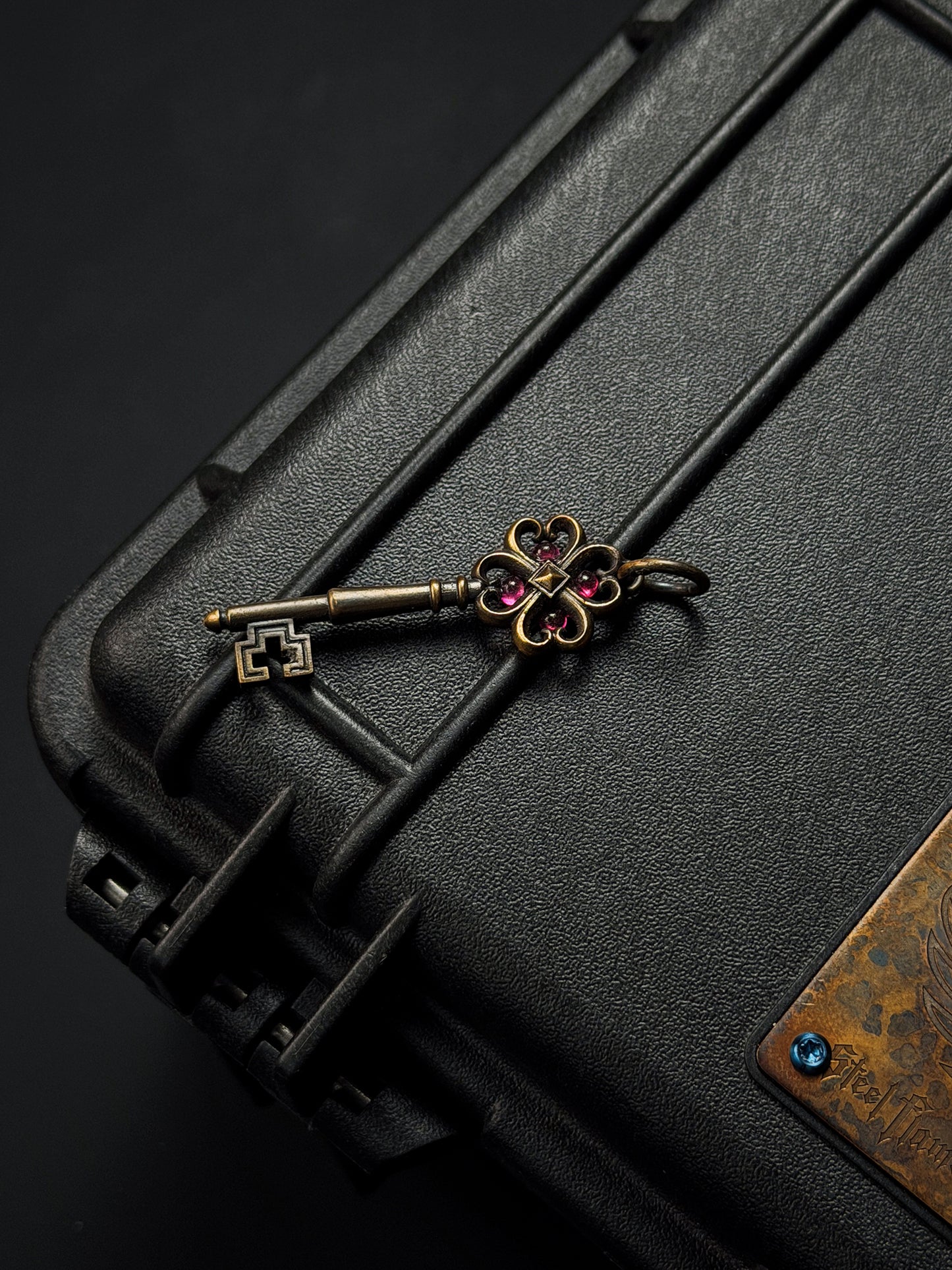 Rare Vintage Steel Flame Bronze Key Pendant with Ruby Inlay