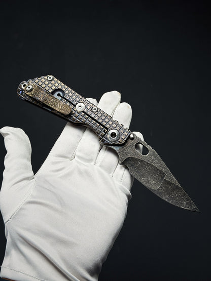 Lava-Carved One-Off | Strider Knives × Monkey Collab – Mike Signed SNG w/ Frag Pattern Titanium Handle