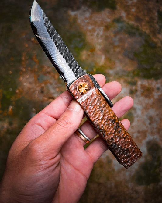 Fat Guard Style Custom Folding Knife – Hand-Forged Damascus San Mai Blade with O1 Core & Hammered Copper Handle (Limited to 20)