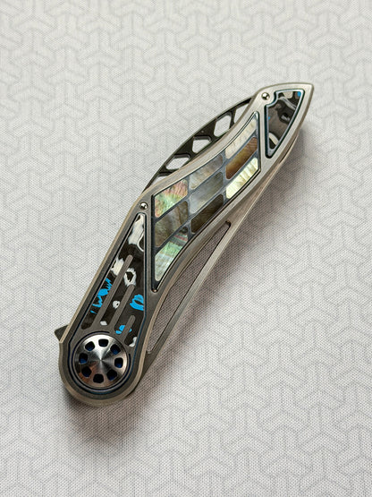 Infinite Charlie Knives | Tianding Quick-Open Folding Knife
Hand-Inlaid Mother-of-Pearl & Ceramic Carbon Fiber