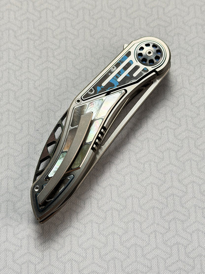 Infinite Charlie Knives | Tianding Quick-Open Folding Knife
Hand-Inlaid Mother-of-Pearl & Ceramic Carbon Fiber