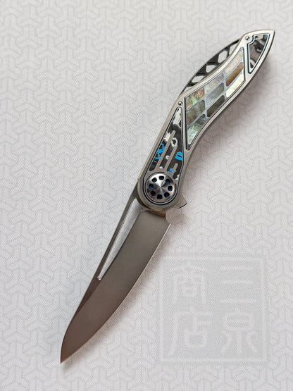 Infinite Charlie Knives | Tianding Quick-Open Folding Knife
Hand-Inlaid Mother-of-Pearl & Ceramic Carbon Fiber