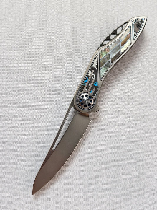 Infinite Charlie Knives | Tianding Quick-Open Folding Knife
Hand-Inlaid Mother-of-Pearl & Ceramic Carbon Fiber