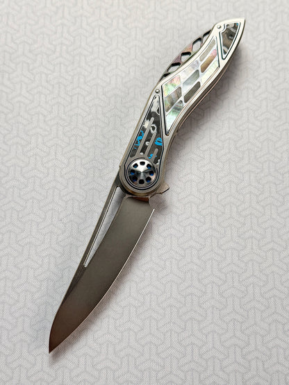 Infinite Charlie Knives | Tianding Quick-Open Folding Knife
Hand-Inlaid Mother-of-Pearl & Ceramic Carbon Fiber