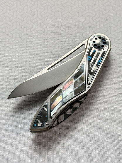 Infinite Charlie Knives | Tianding Quick-Open Folding Knife
Hand-Inlaid Mother-of-Pearl & Ceramic Carbon Fiber