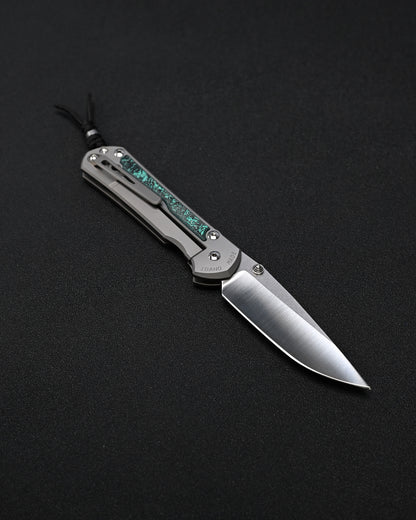 Chris Reeve Knives Large Sebenza 31 – Teal Magnetic CarboTi Inlay / Polished MagnaCut Drop Point / Silver Double Lugs
