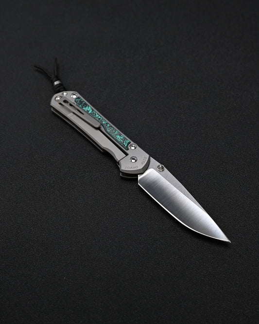 Chris Reeve Knives Large Sebenza 31 – Teal Magnetic CarboTi Inlay / Polished MagnaCut Drop Point / Silver Double Lugs