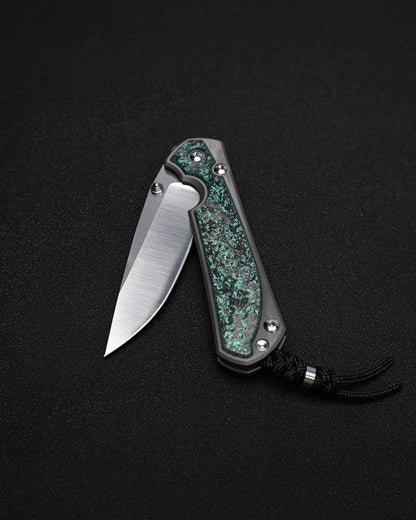 Chris Reeve Knives Large Sebenza 31 – Teal Magnetic CarboTi Inlay / Polished MagnaCut Drop Point / Silver Double Lugs
