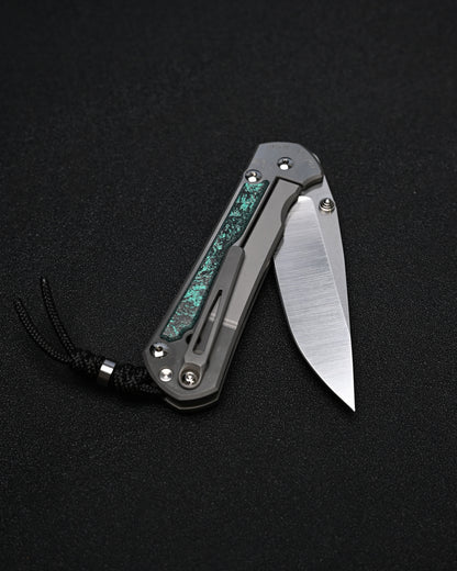 Chris Reeve Knives Large Sebenza 31 – Teal Magnetic CarboTi Inlay / Polished MagnaCut Drop Point / Silver Double Lugs