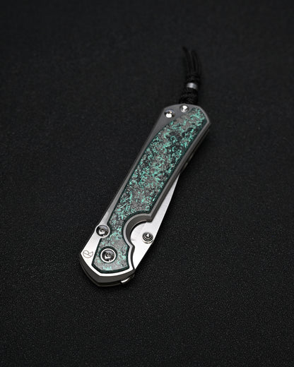 Chris Reeve Knives Large Sebenza 31 – Teal Magnetic CarboTi Inlay / Polished MagnaCut Drop Point / Silver Double Lugs