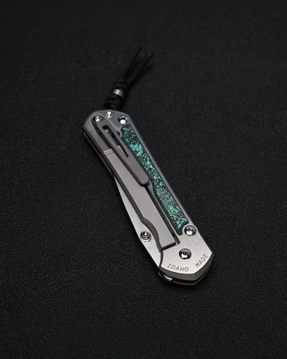 Chris Reeve Knives Large Sebenza 31 – Teal Magnetic CarboTi Inlay / Polished MagnaCut Drop Point / Silver Double Lugs