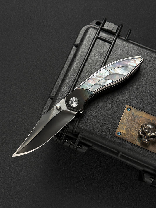 Infinite Charlie Knives Raku II M390 titanium folding knife with mother-of-pearl inlay
