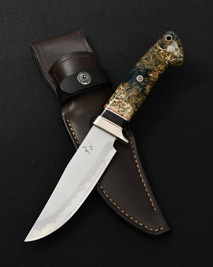 Rare Nishida Hamono handmade Japanese outdoor knife featuring a forged layered Damascus blade and stabilized burl wood handle.