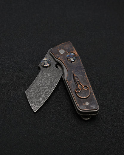 Serge Knives Guppy Custom – Copper Plague Doctor Inlay / Antiqued W2 Blade / Heat-Anodized Titanium – Made in USA